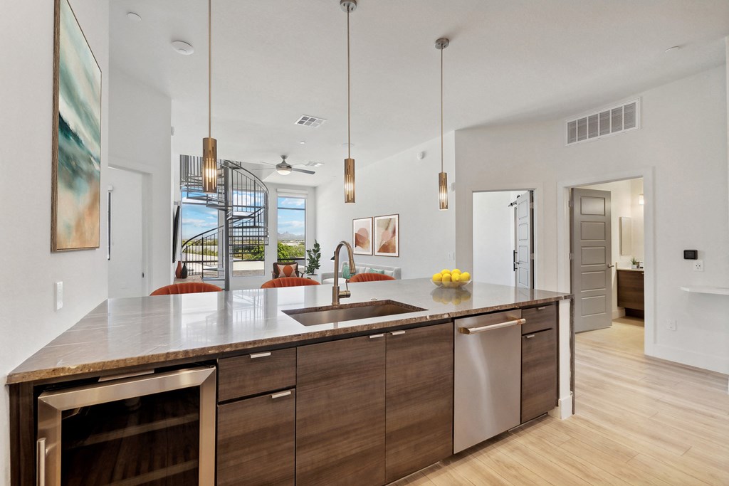 the preserve at ballantyne commons modern kitchen with stainless steel appliances and wood cabinets