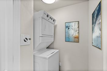 A white oven and dishwasher in a kitchen.