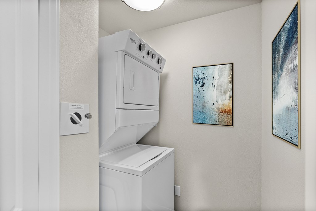 A white oven and dishwasher in a kitchen.