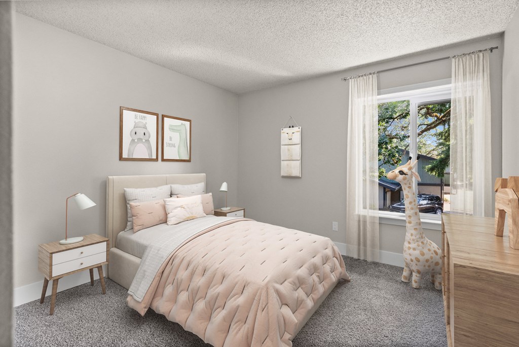 A bedroom with a large bed and a window with a view of a tree.