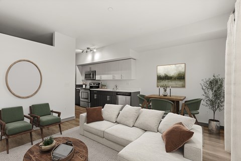 A living room with a white couch and green chairs.