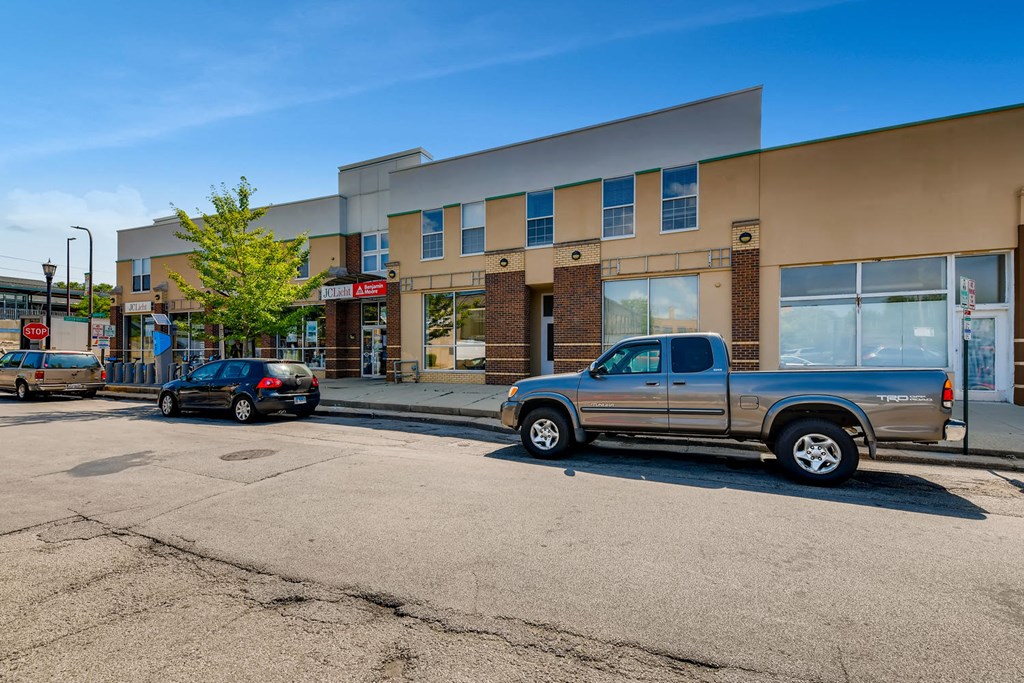 a truck is parked in front of a building