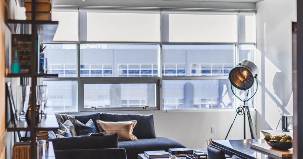 a living room with a couch and a large window