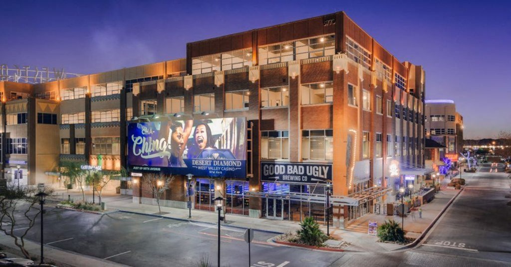 a building with a large billboard on the side of a street