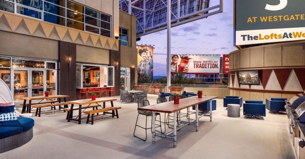 a rendering of the outdoor patio at westgate mall with tables and chairs