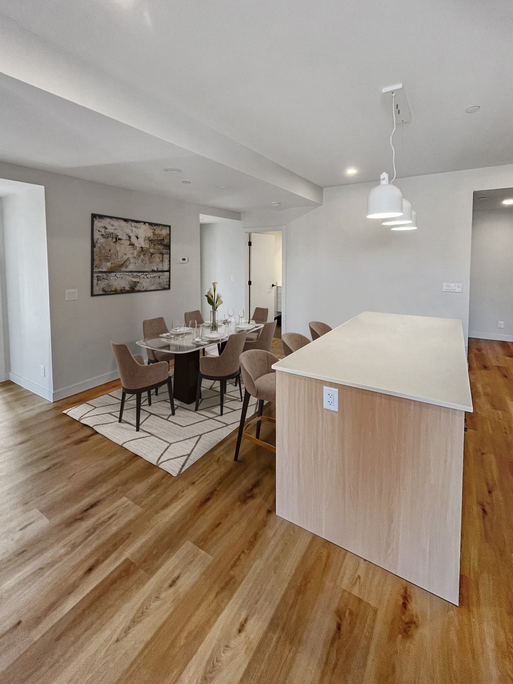 an open kitchen and dining room with a table and chairs