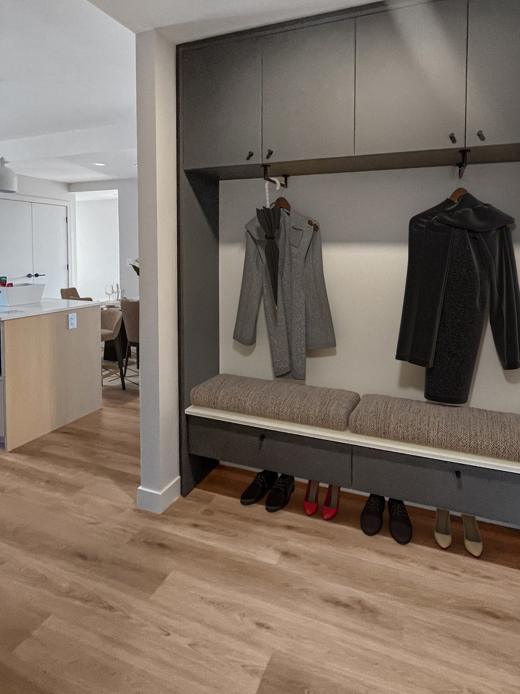 a hallway with a bench and clothes hanging on a wall