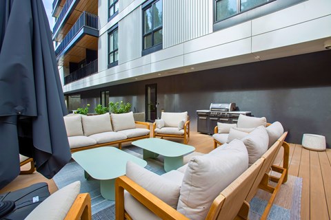 A patio with a table and chairs.