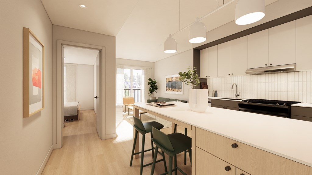 a kitchen with a white counter top and a long island with four chairs