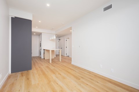 A room with a table and chairs in it.