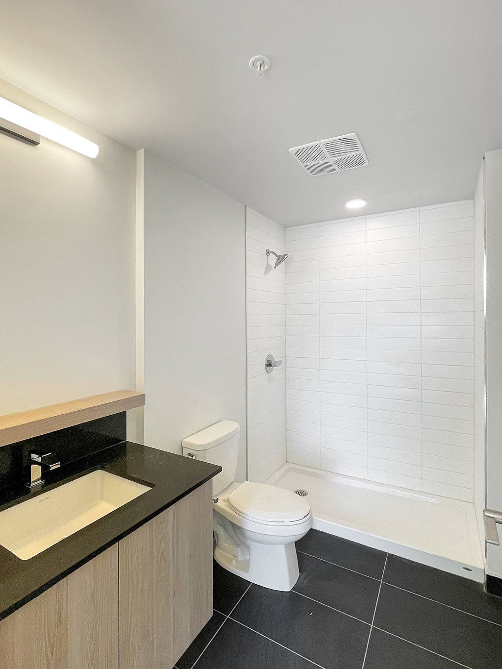 a small bathroom with a toilet and a shower