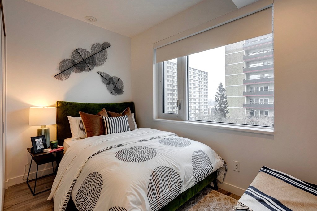 Bedroom With Expansive Windows at Citizen on Jasper, Edmonton, Alberta