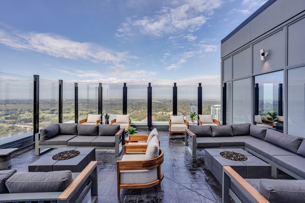 a living room with couches at Citizen on Jasper, Edmonton
