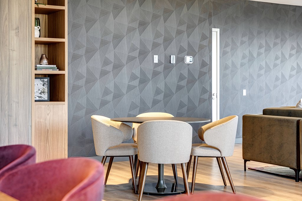 dining room with a table and chairs at Citizen on Jasper, Edmonton, T5K 0M5