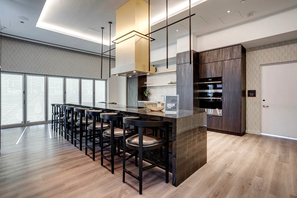 a modern and fancy kitchen with a long island  at Citizen on Jasper, Alberta