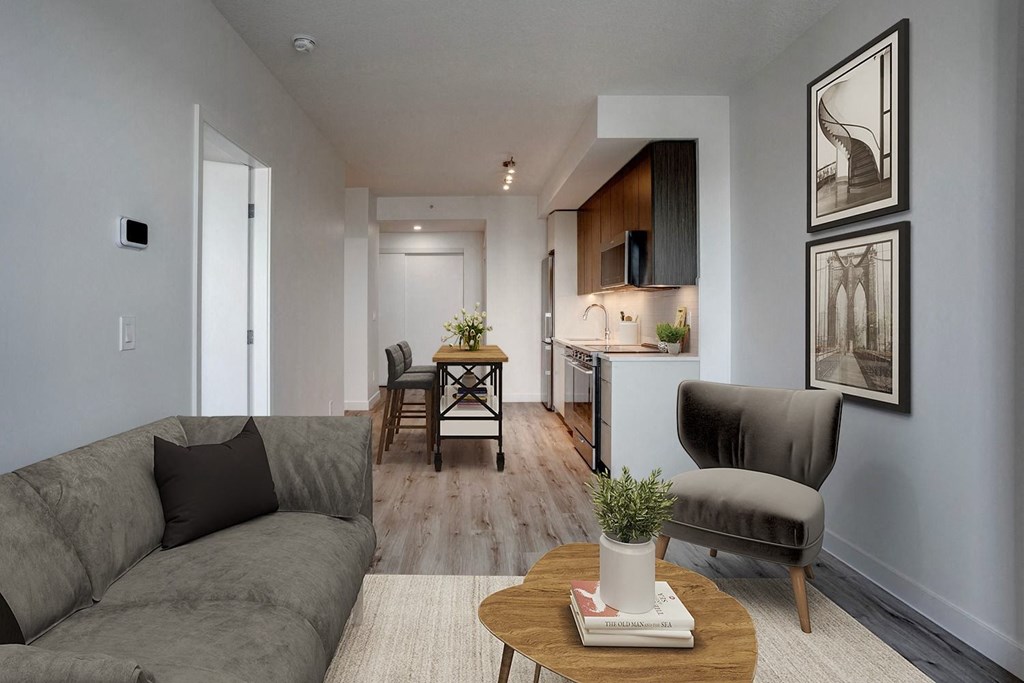 a small living room with a couch and a coffee table  at Citizen on Jasper, Alberta, T5K 0M5