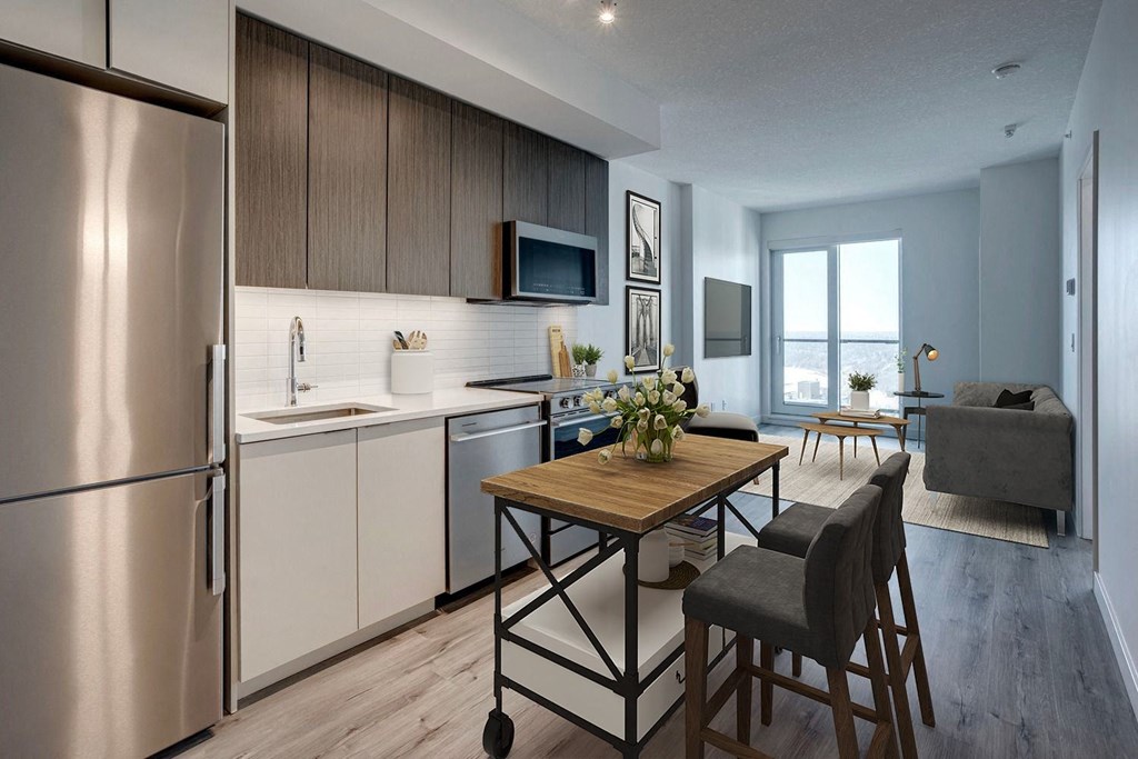 a kitchen and living room in a 555 waverly unit  at Citizen on Jasper, Edmonton, AB, T5K 0M5