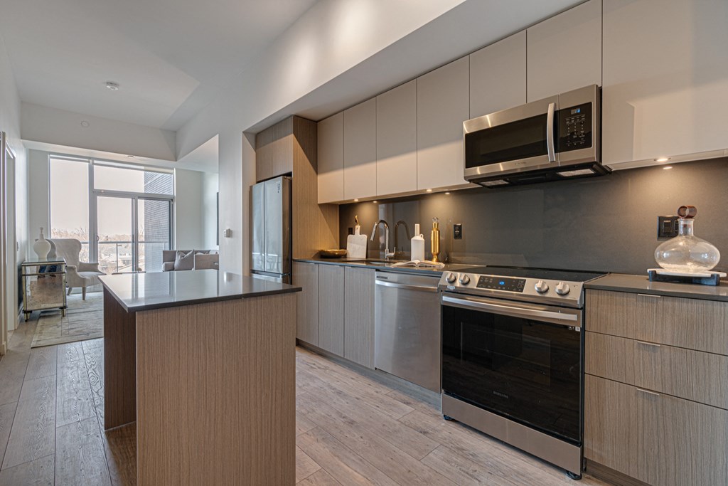 a modern kitchen with stainless steel appliances and a counter top at The Village, Oakville, L6L 0H1