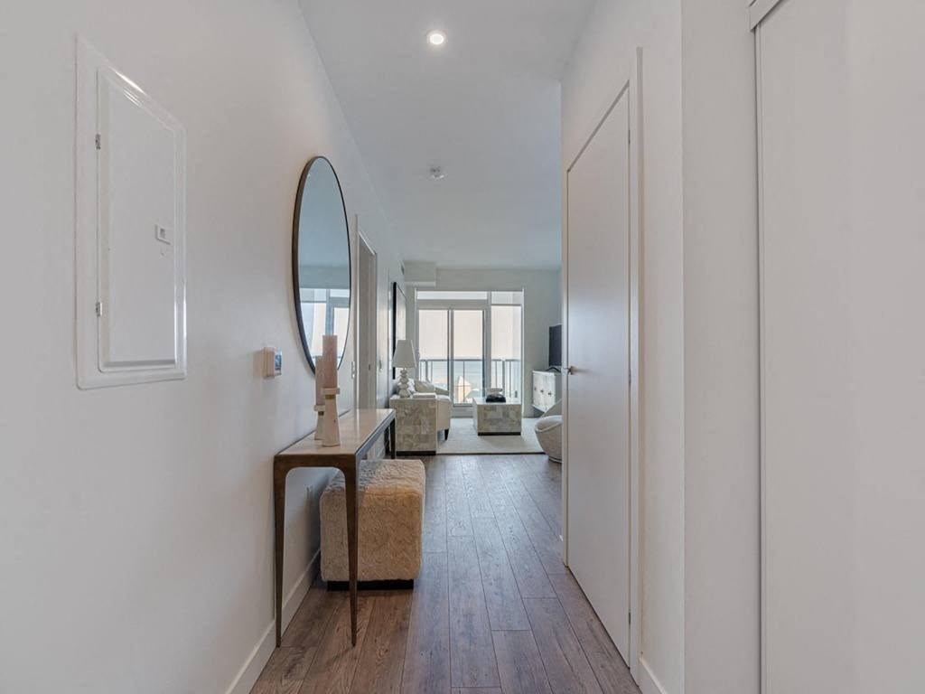 a living room with a mirror and a couch  at The Village, Ontario, L6L 0H1