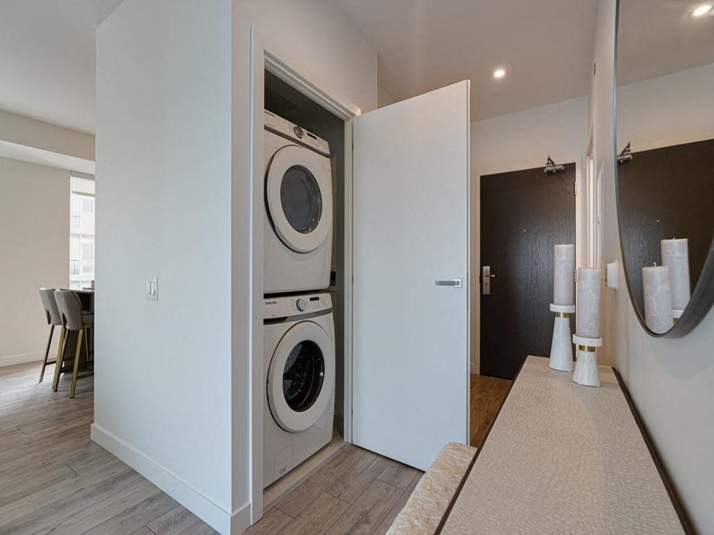 a washer and dryer in a closet in a living room  at The Village, Ontario