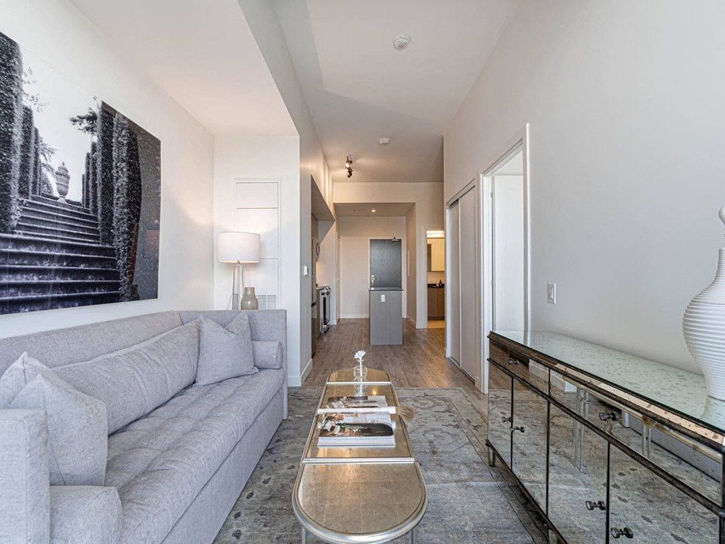 a hallway with shadows on the floor and a staircase at The Village, Oakville, ON, L6L 0H1