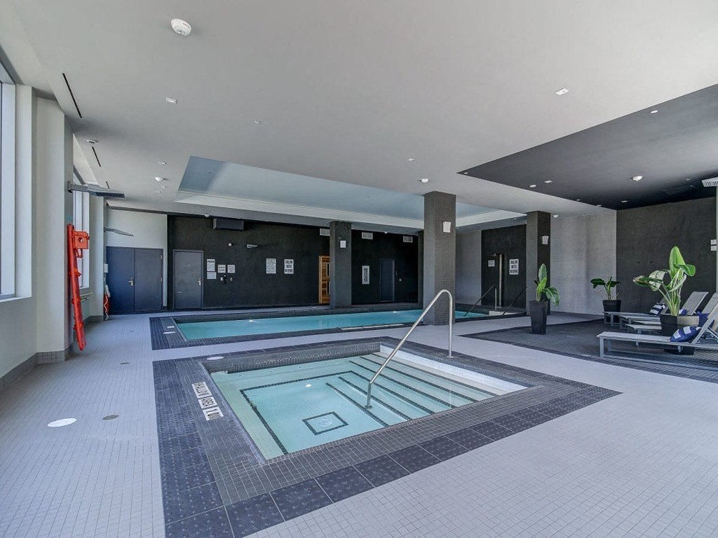 a swimming pool in the lobby of a hotel at The Village, Oakville, L6L 0H1