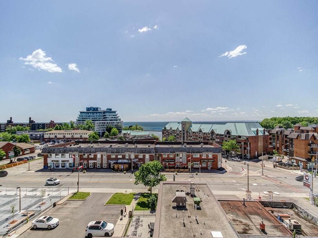 an aerial view of a city street with buildings and the ocean at The Village, Oakville, ON