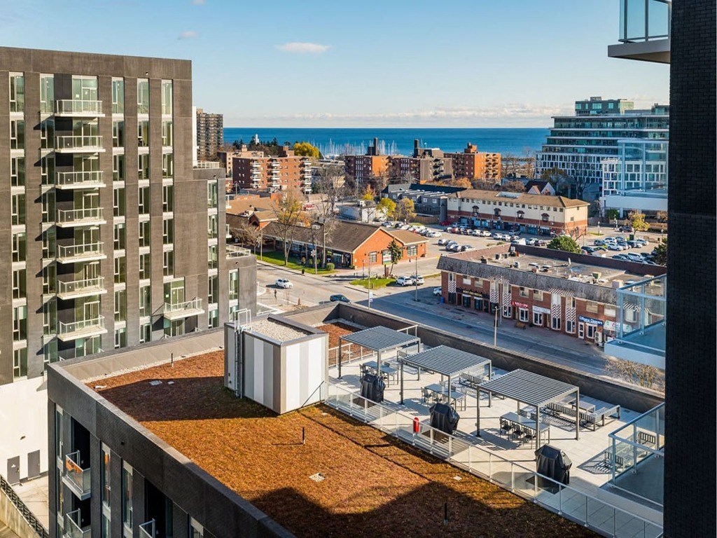 a view of the city and the ocean from a balcony  at The Village, Oakville, ON