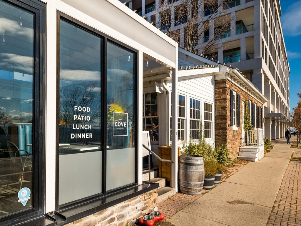 the front of a restaurant with a window with a sign on it  at The Village, Oakville, ON, L6L 0H1