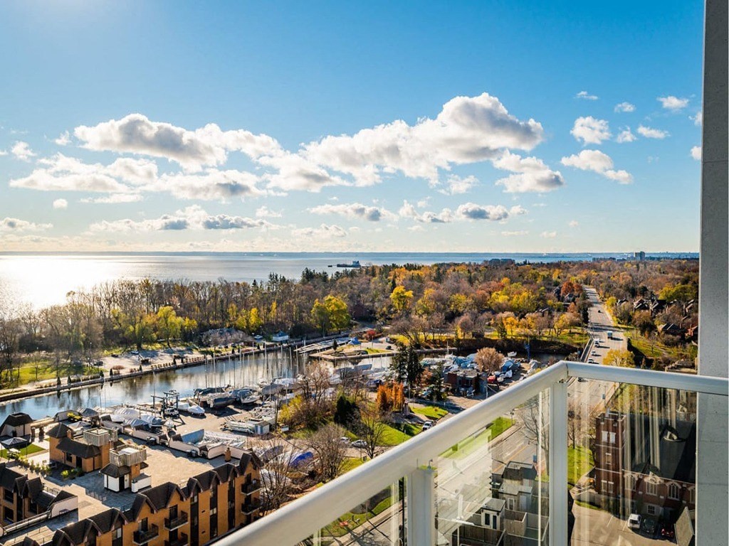 a balcony with a view of a city and a lake at The Village, Ontario, L6L 0H1