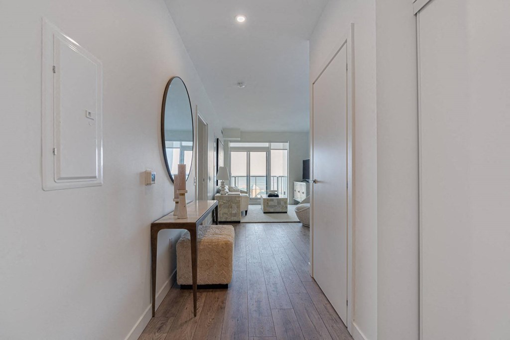 a living room with a couch and a mirror