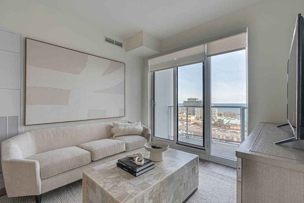 a living room with a white couch and a coffee table