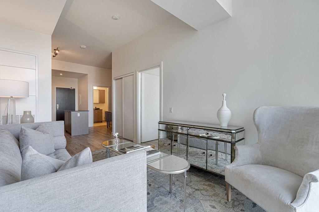 a living room with a couch and a glass table