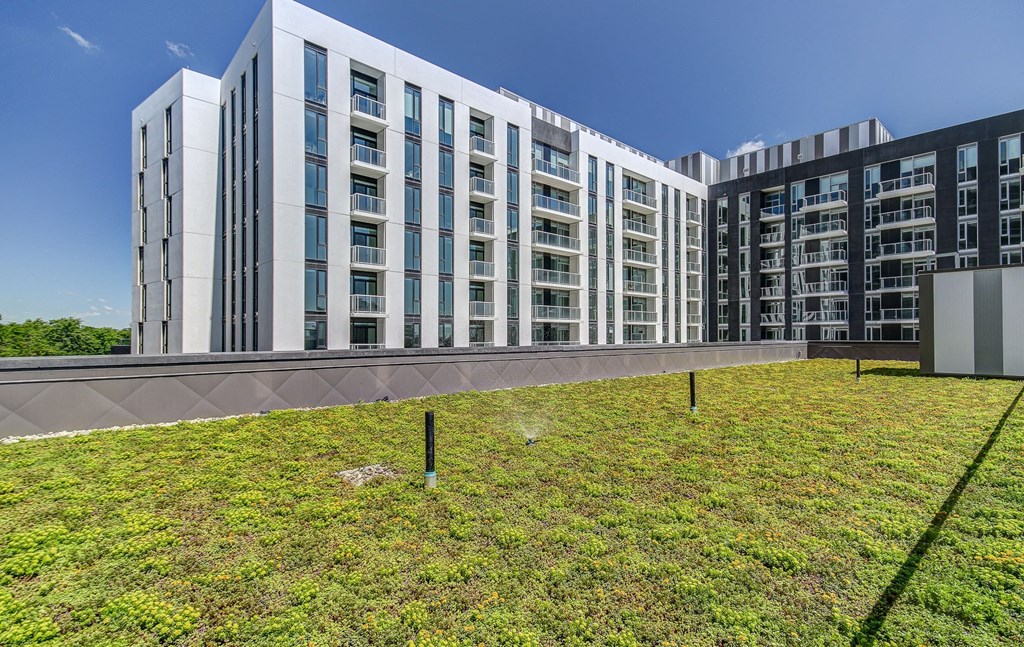 a large building with green grass in front of it