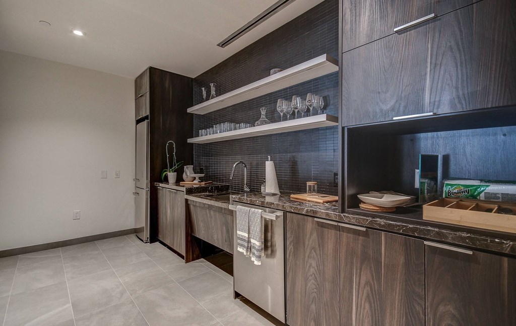 a kitchen with wooden cabinets and stainless steel appliances