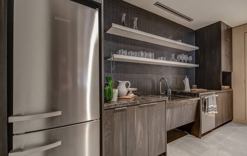 a kitchen with stainless steel appliances and wooden cabinets
