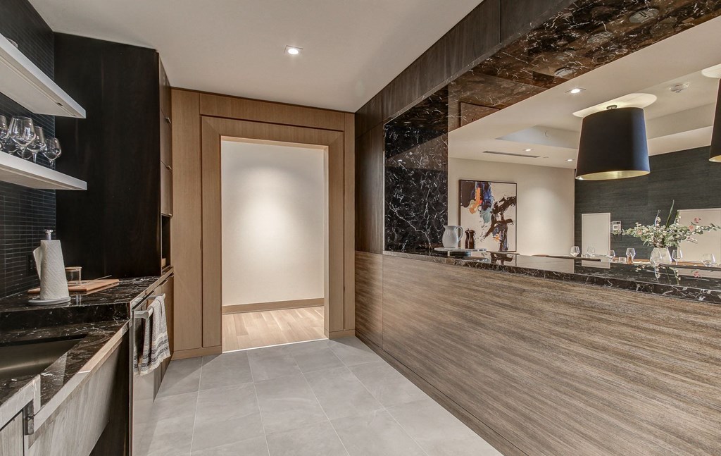 the lobby of a hotel with a reception desk and a door
