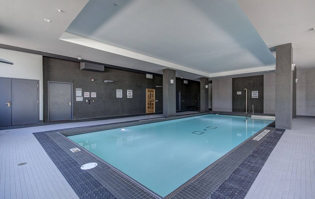 a swimming pool in the lobby of a hotel