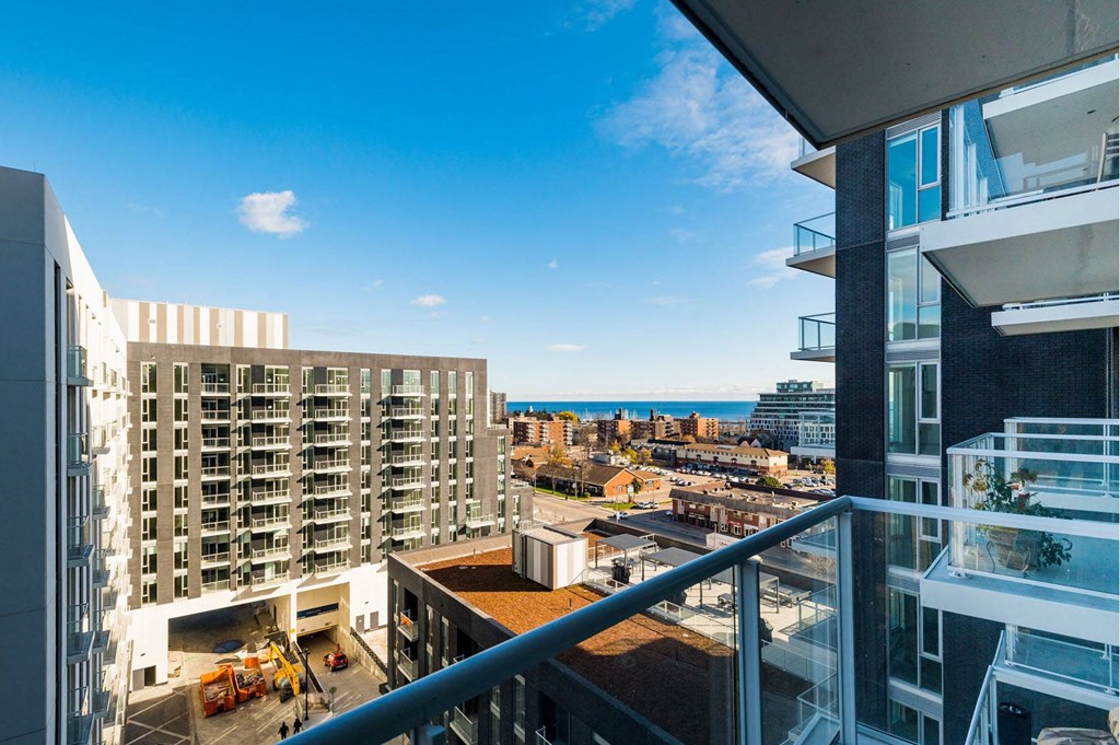 a view of the city and the ocean from a balcony