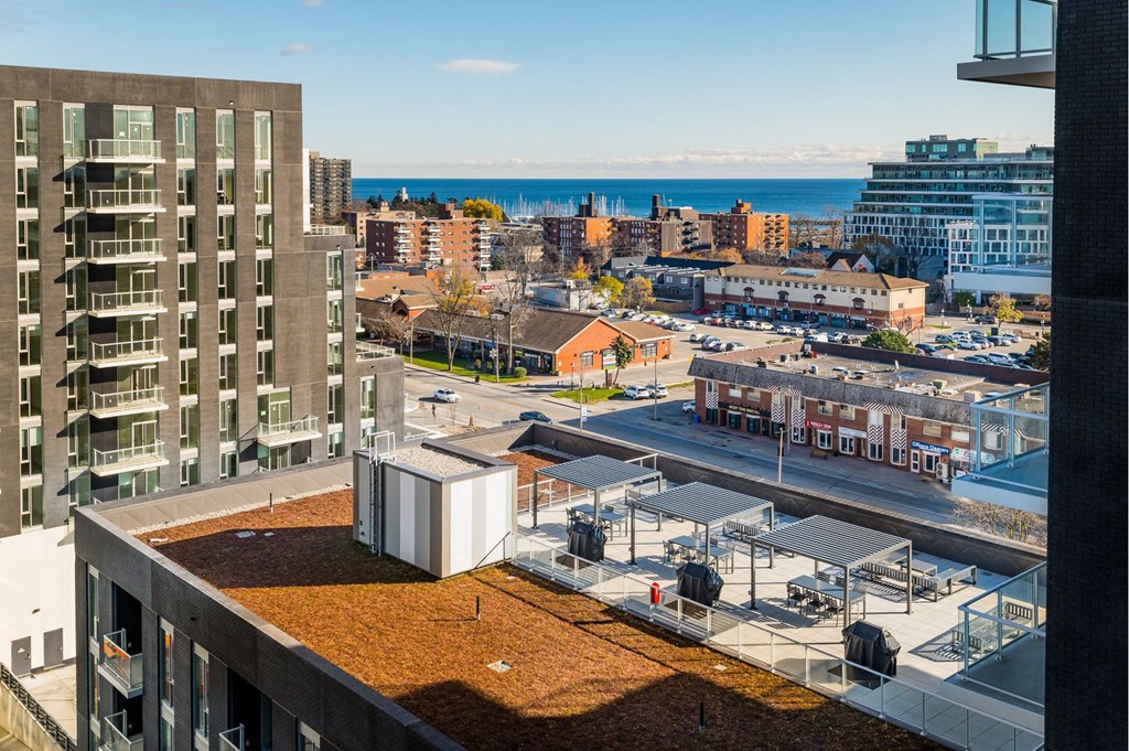 a view of the city and the ocean from a balcony