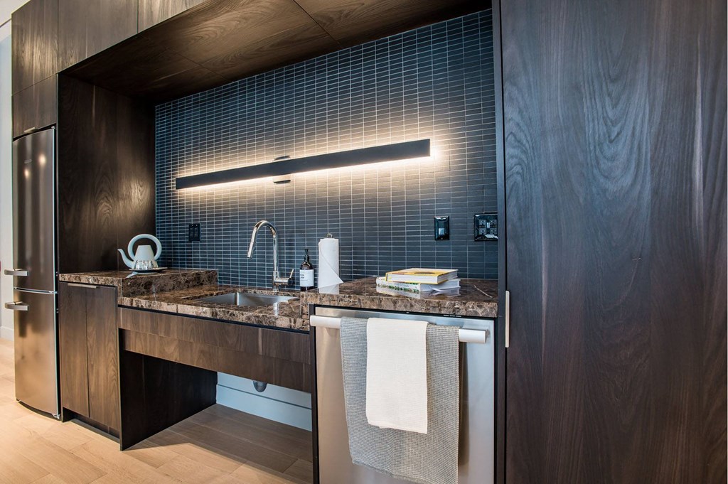 a view of a kitchen with a counter top and a glass