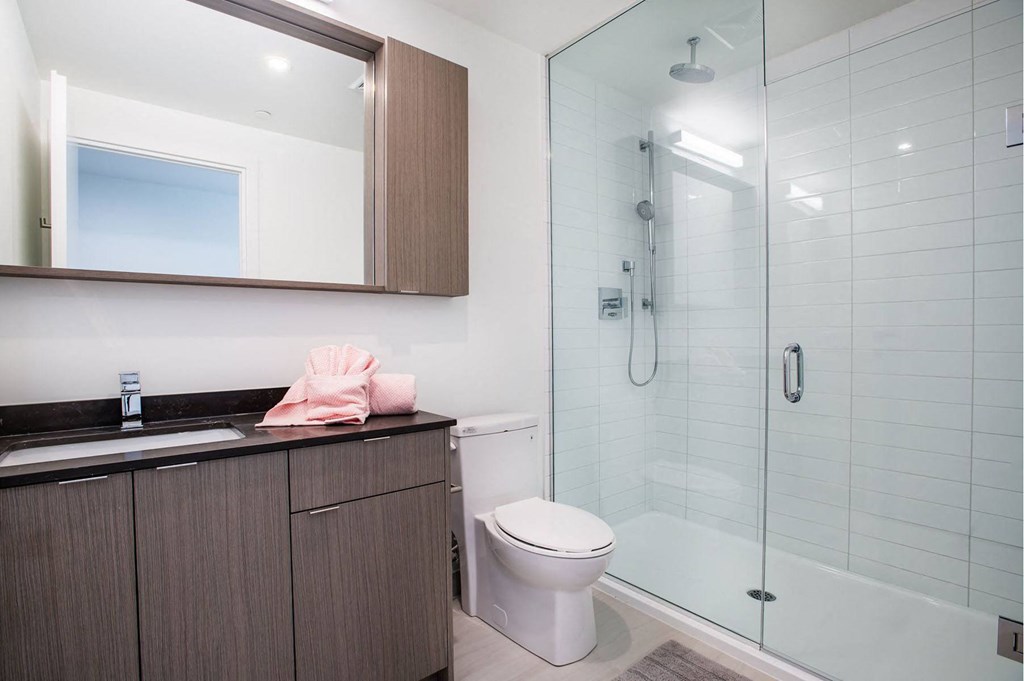 a bathroom with a toilet and a shower