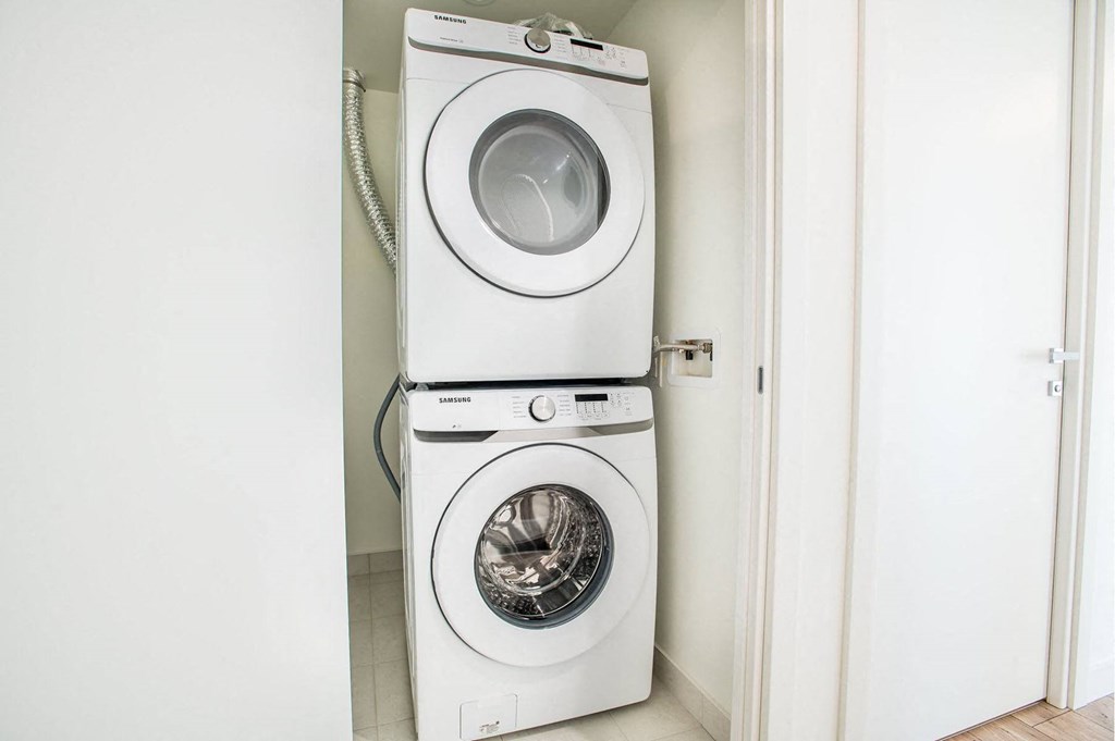 a white washer and dryer in a white room