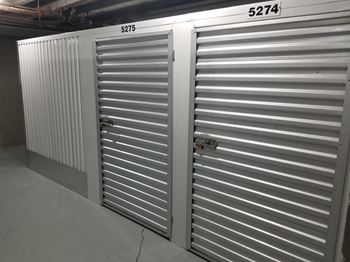 two roll up steel doors in a garage