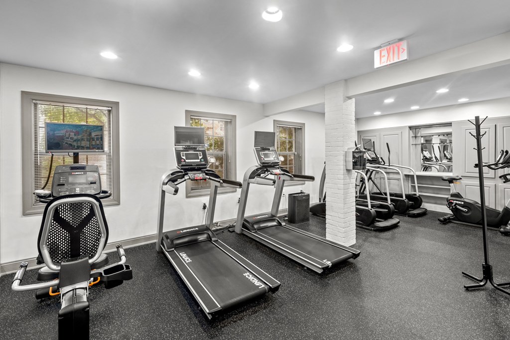 the gym with cardio equipment at the apartments