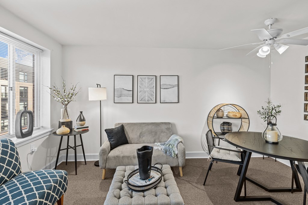 a living room and dining room with a couch and a table