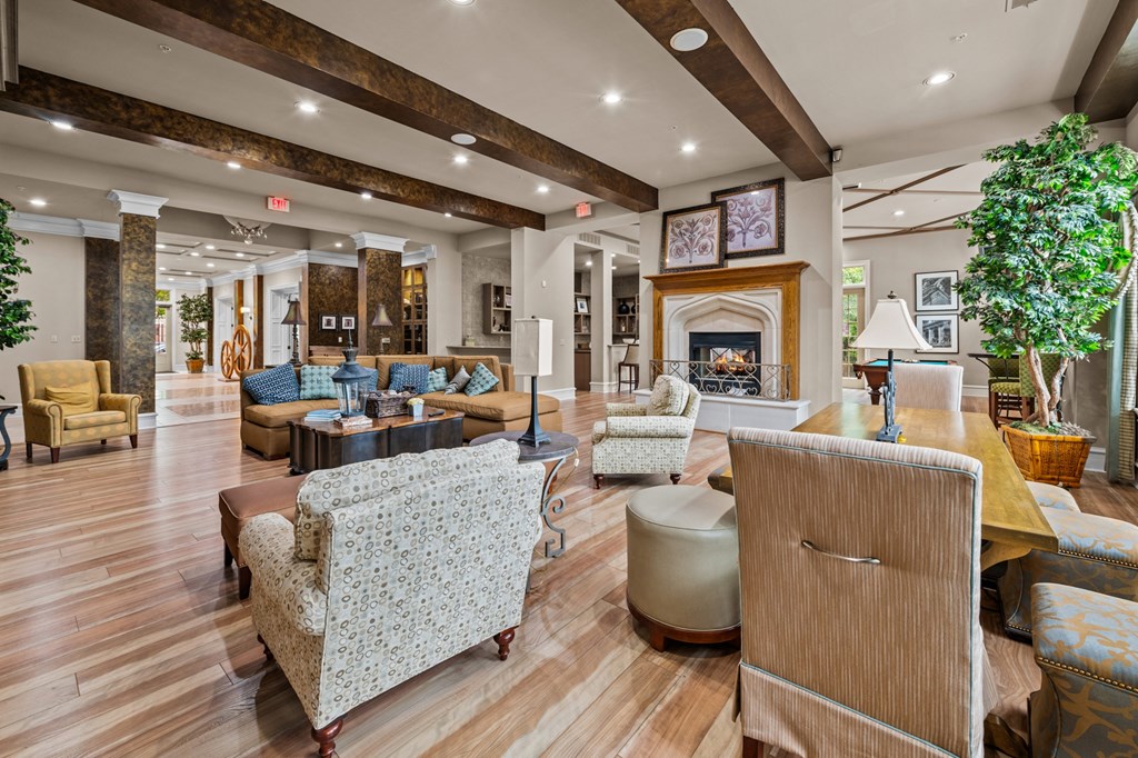 a club house with furniture and a fireplace