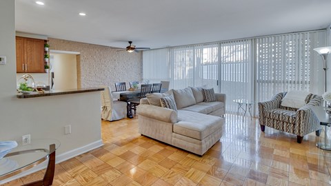 a living room and dining room with a couch and a table