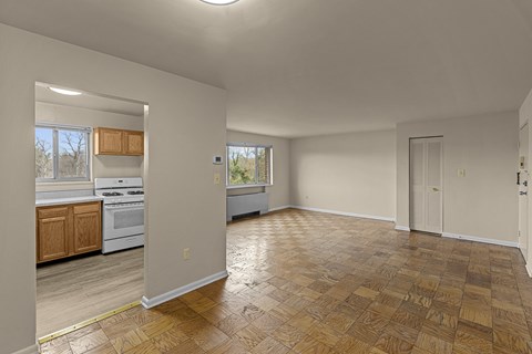 A kitchen with wooden floors and white walls.at Kensington House, Maryland, 20895