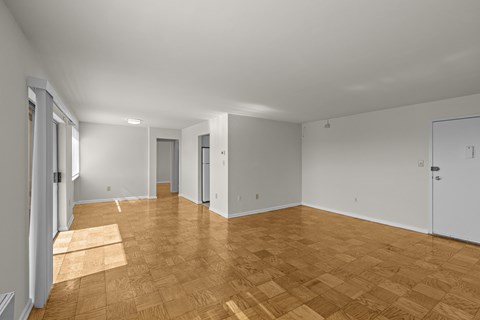 A room with wooden flooring and white walls.at Kensington House, Kensington